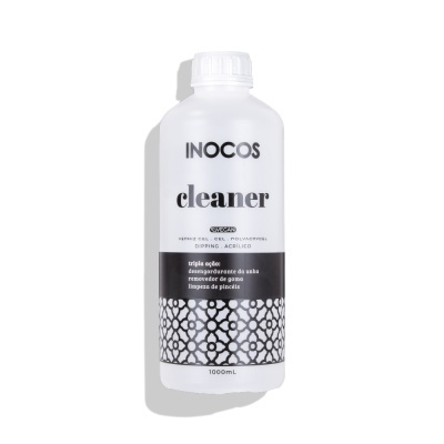 Frasco de plástico branco com rótulo preto e branco de INOCOS cleaner para unhas