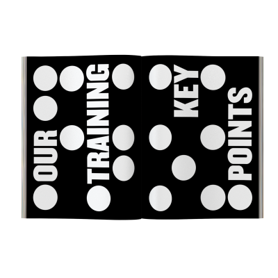 Livro preto com pontos brancos e texto OUR TRAINING KEY POINTS