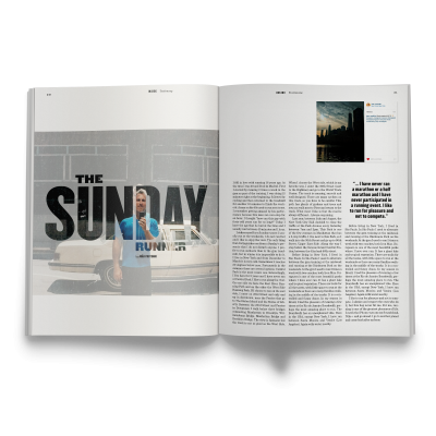 Revista aberta com artigo THE SUNDAY RUN e imagem de fundo com muro cinza e pessoa de camisola azul.