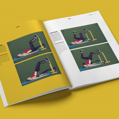 Revista aberta com imagens de exercício físico e equipamento amarelo