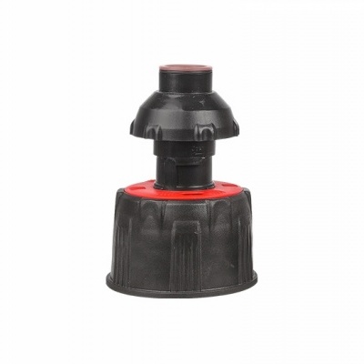 Objeto plástico preto e vermelho em fundo branco