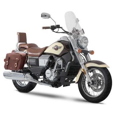 Motocicleta cruiser creme e preta com assento e bagageira castanhos