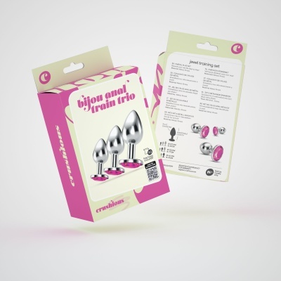 Embalagem de três plugues anais em aço com base rosa em fundo branco