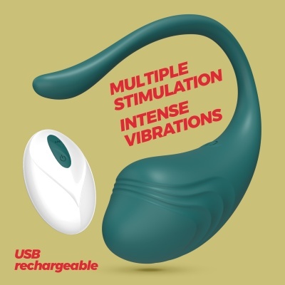 Dispositivo vibratório verde escuro com controle remoto branco em fundo bege