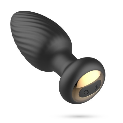 Dispositivo de silicone preto com base dourada e botões