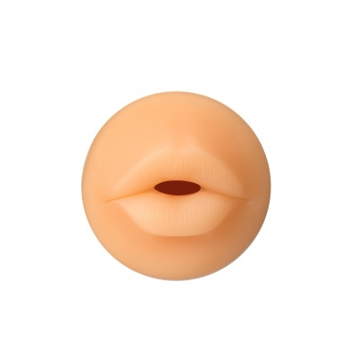 Produto redondo com textura de lábios cor pele e abertura oval.
