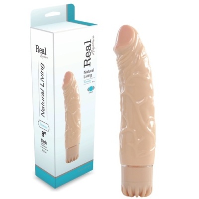 Vibrador cor pele junto à embalagem com texto Real Natural Living