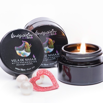 Vela de massagem em frasco preto com tampa e acessórios decorativos