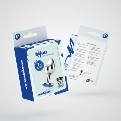 Embalagens azuis e brancas para plugues anais metálicos decorados com texto e instruções.