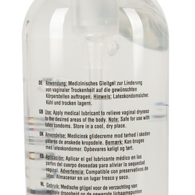 Frasco transparente com dispensador branco e texto multilingue no rótulo