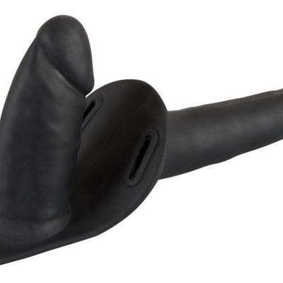 Acessório sexual preto em silicone com duas extensões e base com aberturas para fixação