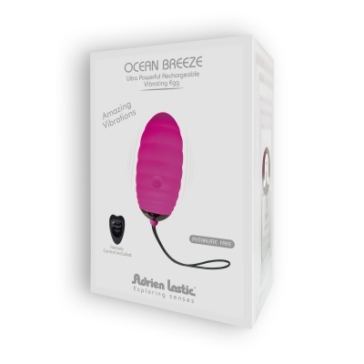 Caixa branca com vibrador rosa texto Ocean Breeze e controle remoto preto
