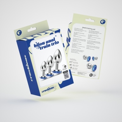 Embalagem azul e branca com acessórios metálicos e bases azuis para treino anal