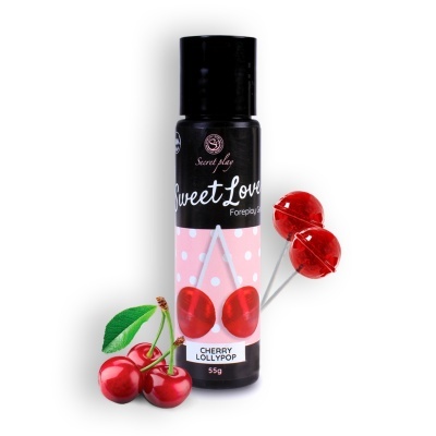 Frasco de produto com rótulo rosa e pirulitos vermelhos com cerejas