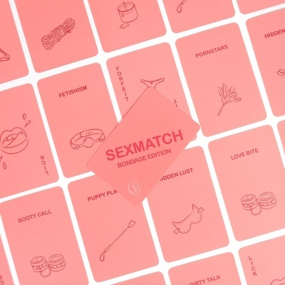 Cartas de jogo Sexmatch Bondage Edition com temas e ícones relacionados a fetiches e BDSM em fundo rosa.