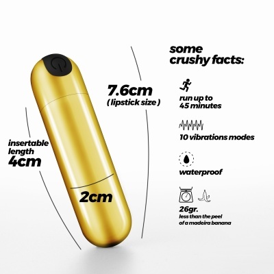 Vibrador dourado em forma de batom com texto informativo sobre dimensões e características.