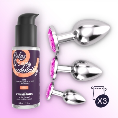 Conjunto de três plugues anais de metal com pedras cor-de-rosa e frasco de lubrificante