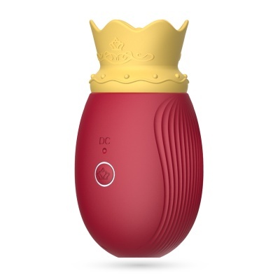 Dispositivo vermelho oval com tampa amarela em forma de coroa e botão 'DC'