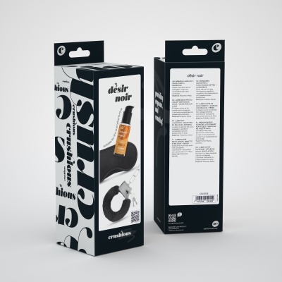 Embalagem preta e branca do produto désir noir com frasco dourado visível