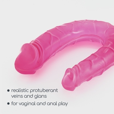 Dildo cor-de-rosa translúcido em forma de ferradura com veias e glande destacadas.