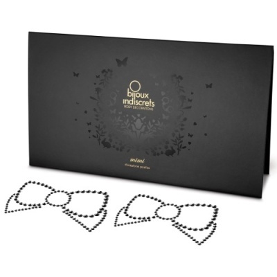 Conjunto de acessórios para o corpo com padrão de laço e embalagem preta marcada.