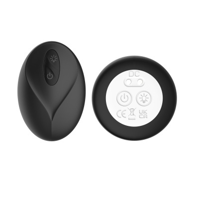 Dispositivo eletrônico preto com botões de controle e parte circular branca com símbolos e marcações