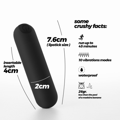 Vibrador preto compacto com indicação de dimensões e características técnicas em texto preto ao lado