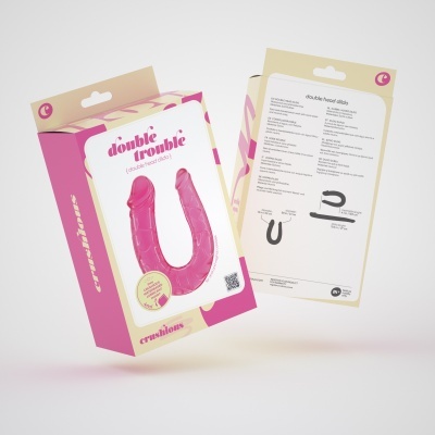 Embalagem de produto em silicone rosado em forma de U com texto 'double trouble'