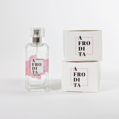 Frasco de perfume transparente com duas caixas brancas ao lado, todas com logotipo 'AFRODITA'