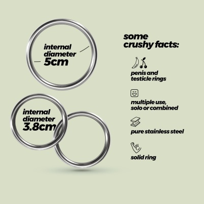 Três anéis metálicos prateados com texto informativo sobre uso e material