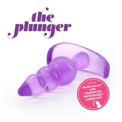 Plug anal roxo translúcido com três esferas e base larga, texto 'the plunger' e selo vermelho de recomendação de lubrificante.