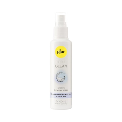 Frasco de spray branco com rótulo amarelo e texto pjur med CLEAN