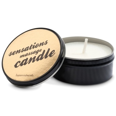 Vela massageadora em recipiente metálico preto e tampa dourada com escrito sensations massage candle