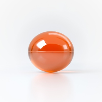 Esfera laranja brilhante sobre superfície branca