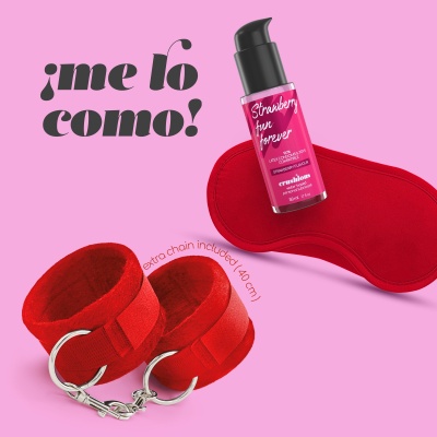 Spray vermelho, tapa-olho vermelho e algemas vermelhas com corrente sobre fundo cor-de-rosa