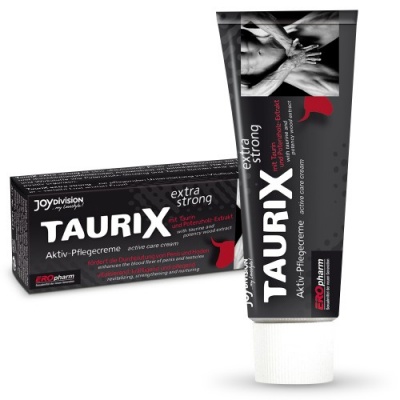 Tubo e caixa do creme ativo TAURIX extra strong preto com texto em branco e vermelho.