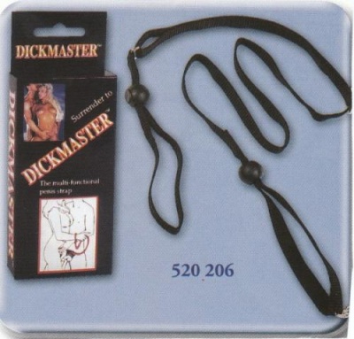 Produto 'penis strap' multifuncional negro com embalagem preta DICKMASTER