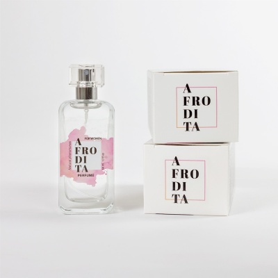 Frasco de perfume transparente com duas caixas brancas ao lado, todas com logotipo 'AFRODITA'