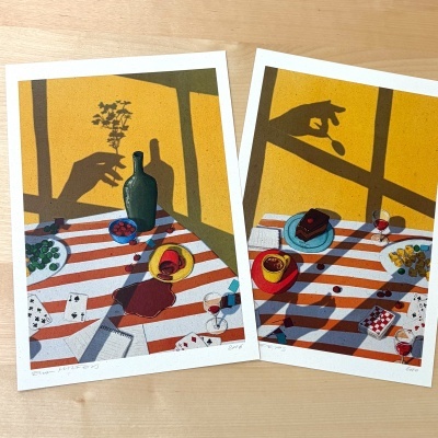 Dois impressos artísticos com cenas de mesa e sombras de mãos