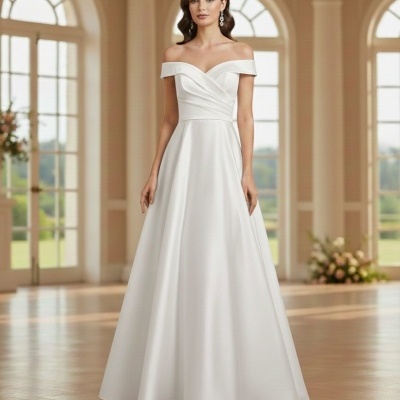 Vestido de noiva branco ombro a ombro com saia ampla num salão iluminado