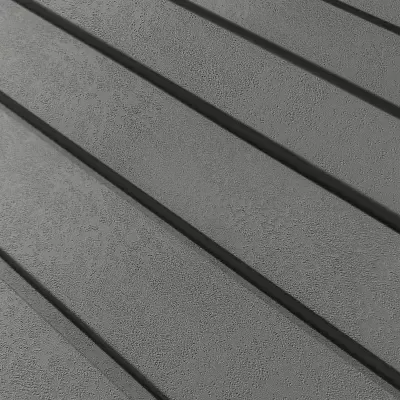 Superfície cinza texturada com sombras diagonais longas e escuras
