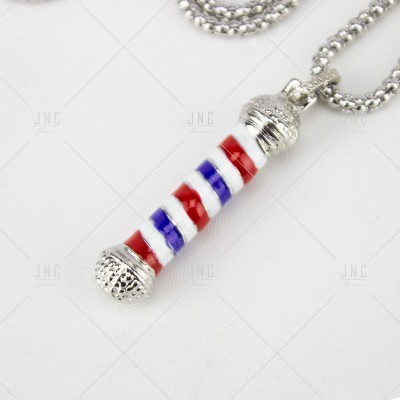 Colar com pendente de vara de barbeiro em riscas coloridas