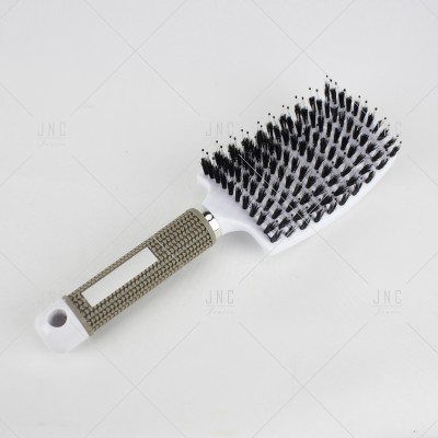 Escova de cabelo branca e cinza com cerdas pretas e brancas