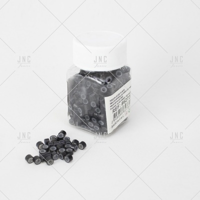 Frasco de plástico com contas pretas cilíndricas e tampa branca