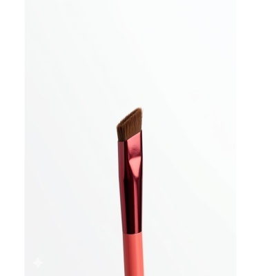 Pincel de maquilhagem coral e vermelho com cerdas anguladas
