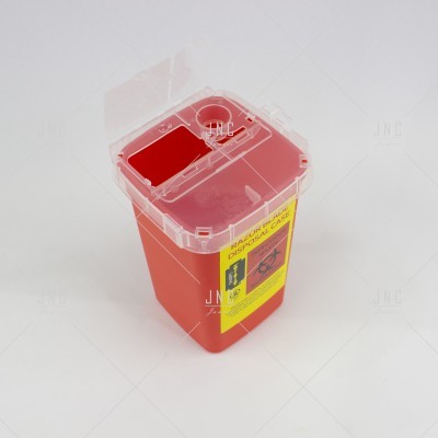 Recipiente vermelho para descarte de objetos perfurocortantes com etiqueta amarela