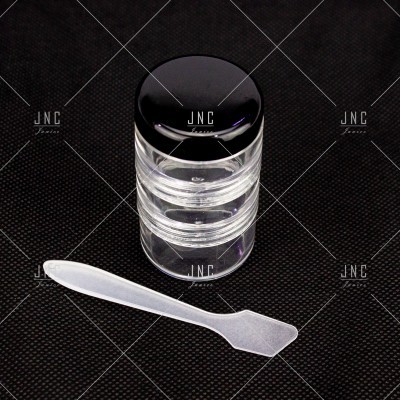 Frasco transparente com tampa preta e espátula branca transparente