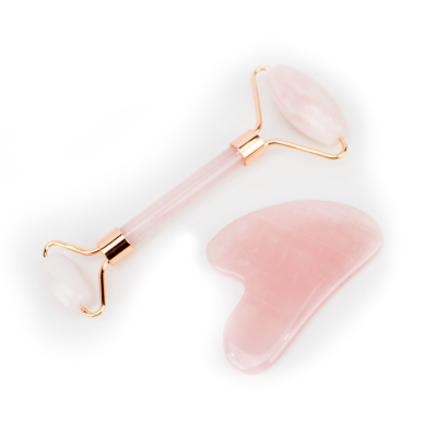 Massajador facial e pedra Gua Sha em quartzo rosa
