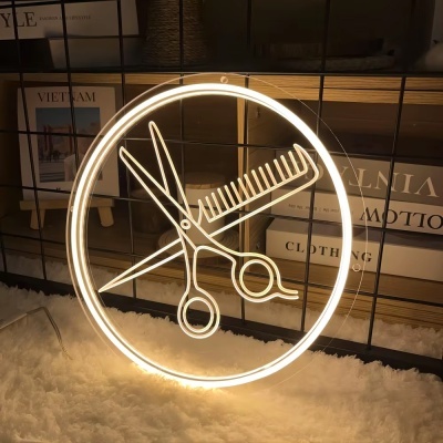 Sinal de neon circular com tesoura e pente brancos iluminados