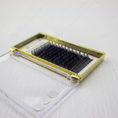 Caixa de pestanas falsas com moldura dourada e tampa transparente